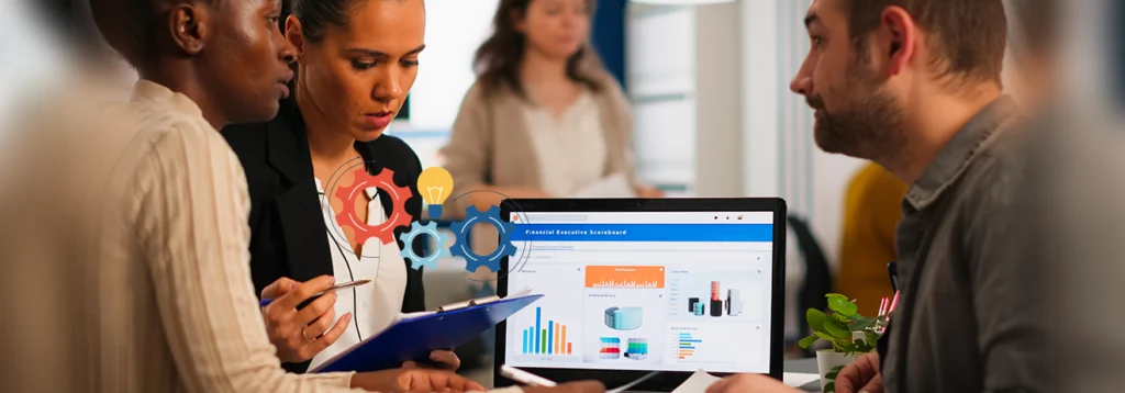 Team of professionals reviewing a data dashboard on a laptop, with gears and a lightbulb symbolizing collaboration and ideas.